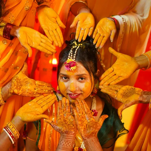 A haldi ceremony photographed in yellow